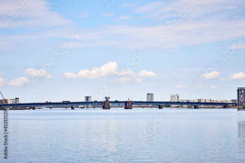 a large blue bridge in denmark on a sunny day