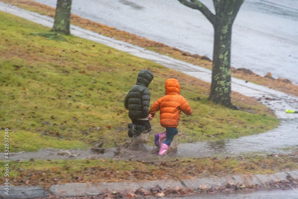 children in the rain