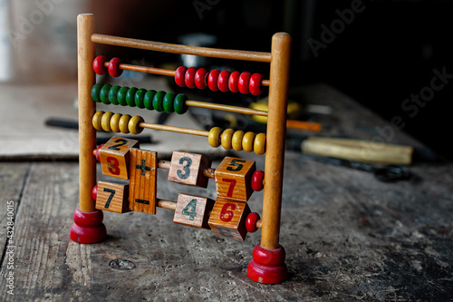 Fotografija Abacus close up on a wooden table.