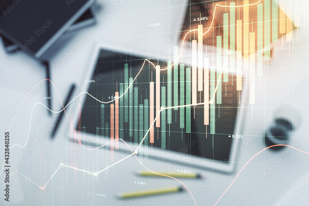 Multi exposure of abstract creative financial graph and modern digital tablet on background, top view, forex and investment concept Multi exposure of abstract creative financial graph and modern digital tablet on background, top view, forex and investment concept