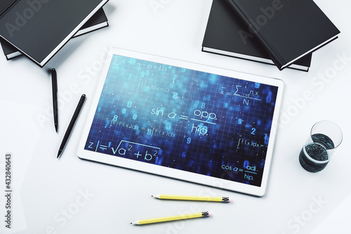 Modern digital tablet monitor with creative scientific formula illustration, research and development concept. Top view. 3D Rendering