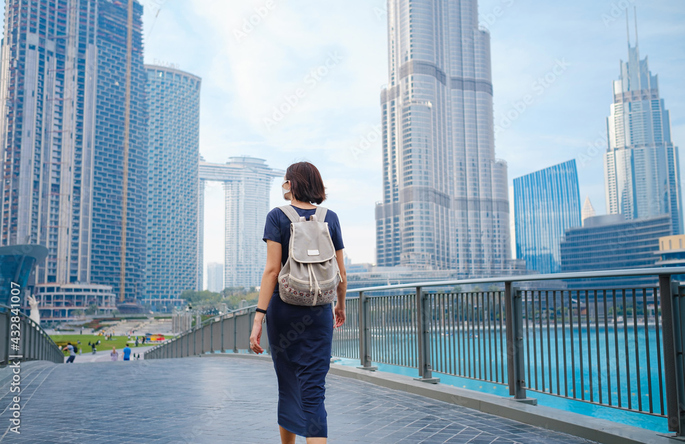 Young beautiful woman enjoying the view of Dubai downtown.