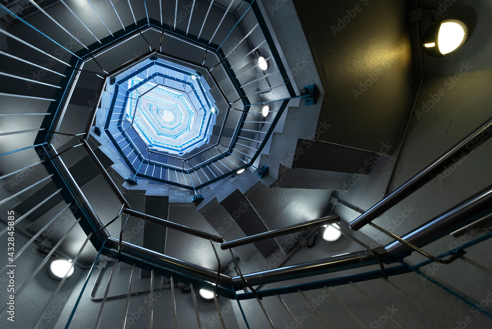 Fototapeta premium Interior view of modern spiral stairway. Building abstract background