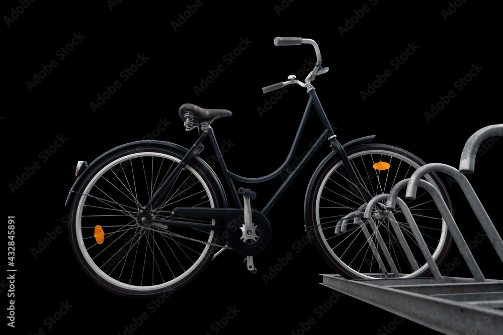 Low angle view of black traditional parked bike on dark background
