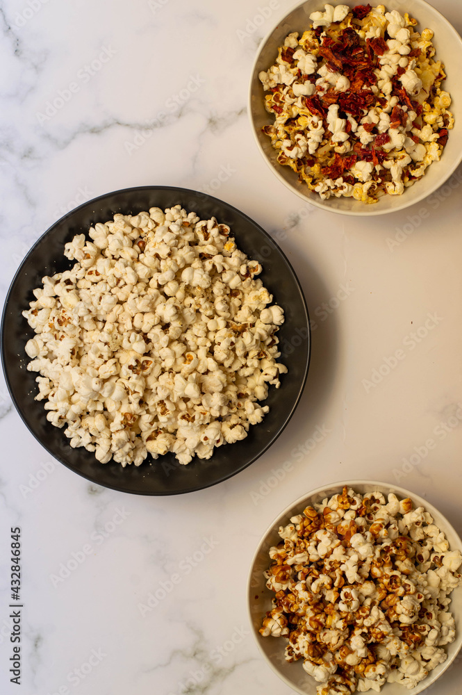 A bowl full of pop corn on a white background A bowl full of pop corn on a white background