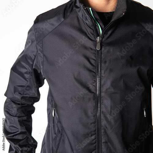 black men's windbreaker jacket on model on white background photo