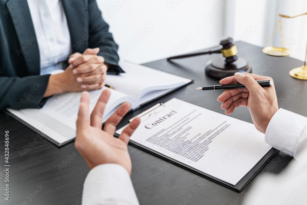 Lawyer discuss the contract and legal document agreement in office. Law and legal concept Lawyer discuss the contract and legal document agreement in office. Law and legal concept