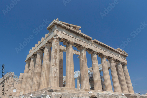 The ancient Parthenon temple on Acropolis hill, famous landmark and tourist attraction in Athens, Greece, in sunny summer day