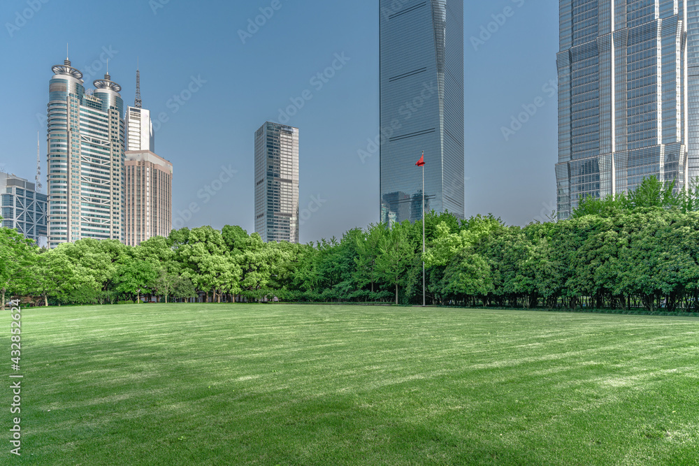 Lujiazui central park, green grass and modern skycrapers,  for background.