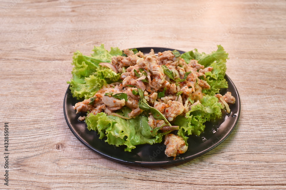 Thai spicy chop chicken salad and fresh vegetable on plate Thai spicy chop chicken salad and fresh vegetable on plate