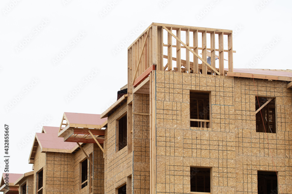 walls and rafters of a plywood house frame