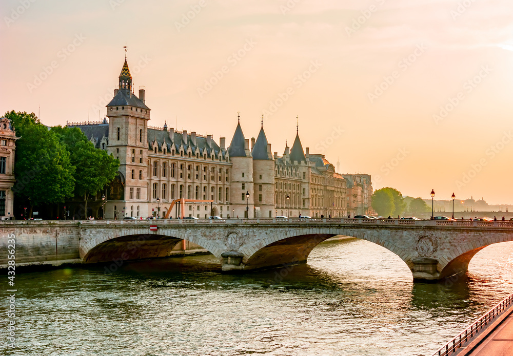 Conciergerie palace at sunset over Seine river, Paris, France