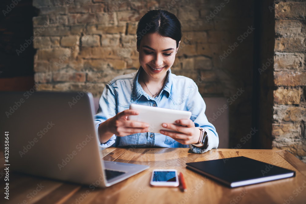 Happy woman watching video on tablet Happy woman watching video on tablet