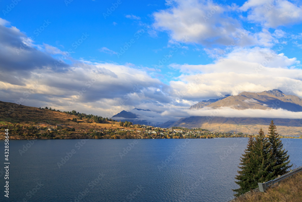 Lake Wakatipu, South Island, New Zealand, and surrounding mountains. Across the water is Kelvin Heights, part of the resort town of Queenstown