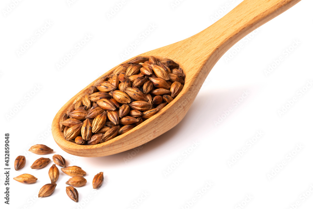Barley Tea in the wooden spoon, isolated on pure white background