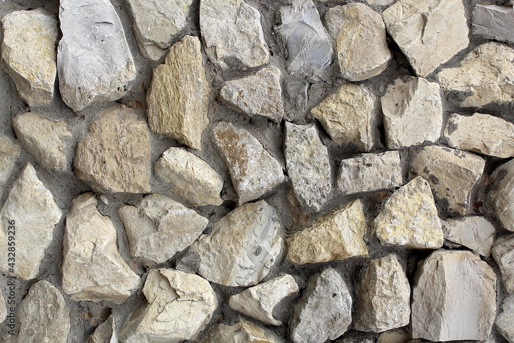 Texture of rough stones poured with concrete