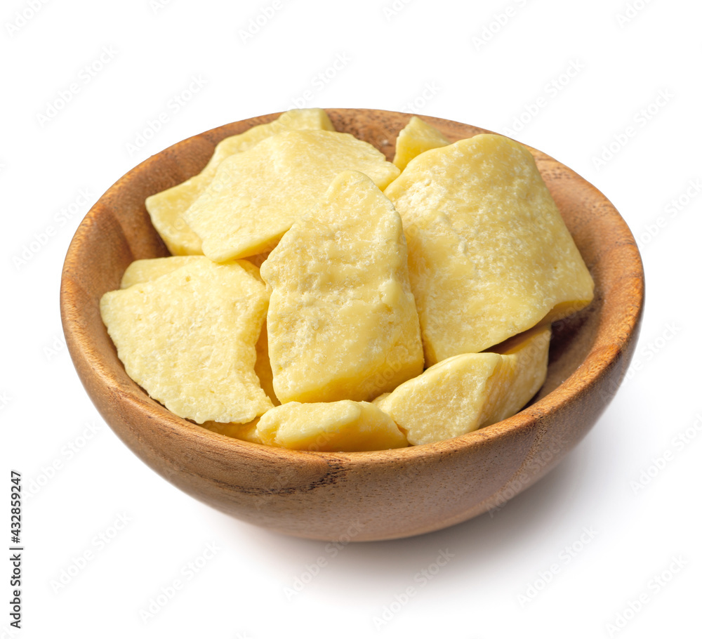 cocoa butters in the wooden bowl, isolated on white background cocoa butters in the wooden bowl, isolated on white background
