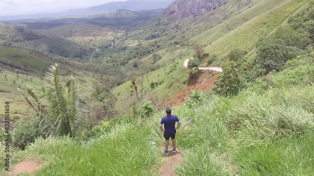 Person walking in the mountains Person walking in the mountains