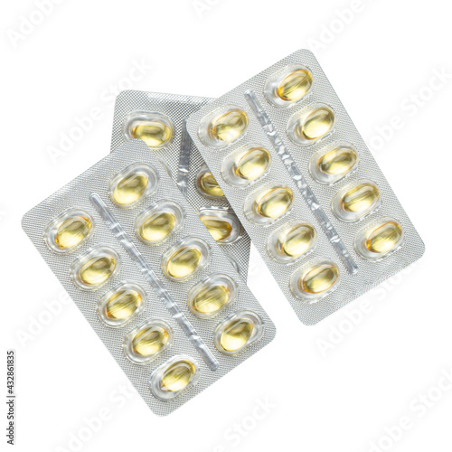 Blister pack of fish oil capsules isolated on white background. File contains clipping path. Packs of medical pills tablets vitamins, top view.