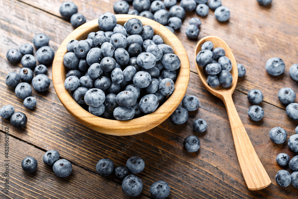 Juicy and fresh blueberries on a rustic table. Vegan and vegetarian concept. Juicy and fresh blueberries on a rustic table. Vegan and vegetarian concept.