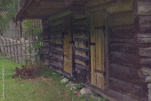 Old wooden farm. Rural landscape. The open air Museum in Tallinn. Retro toned.