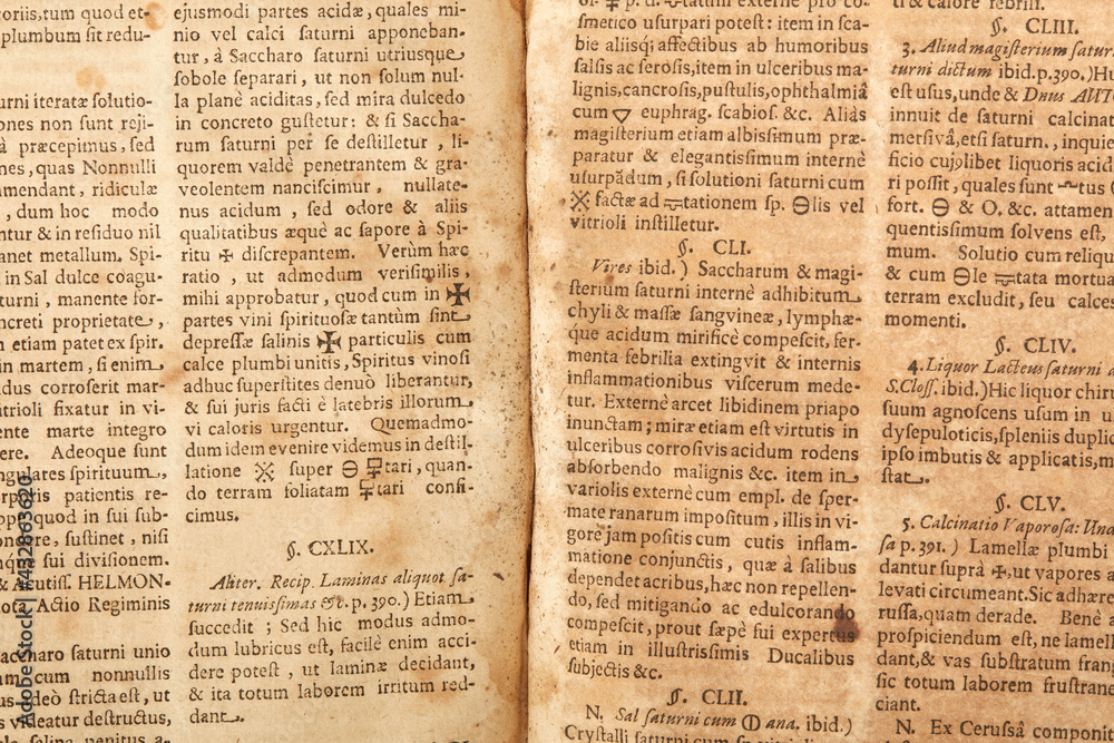 Obraz premium Old book pages with latin writings and mold texture background