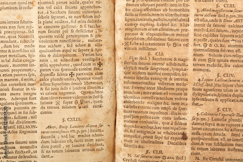 Old book pages with latin writings and mold texture background