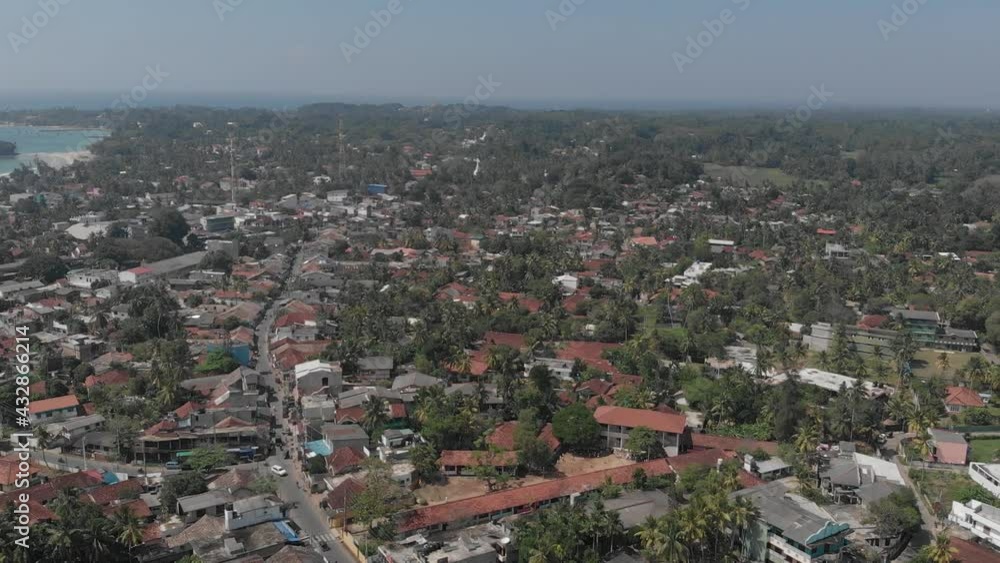Drone flying over Weligama, Sri Lanka. Amazing aerial view of city street. Drone flying over Weligama, Sri Lanka. Amazing aerial view of city street.