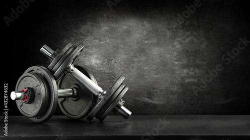 Dumbells on desk and free space for your decoration.  photo