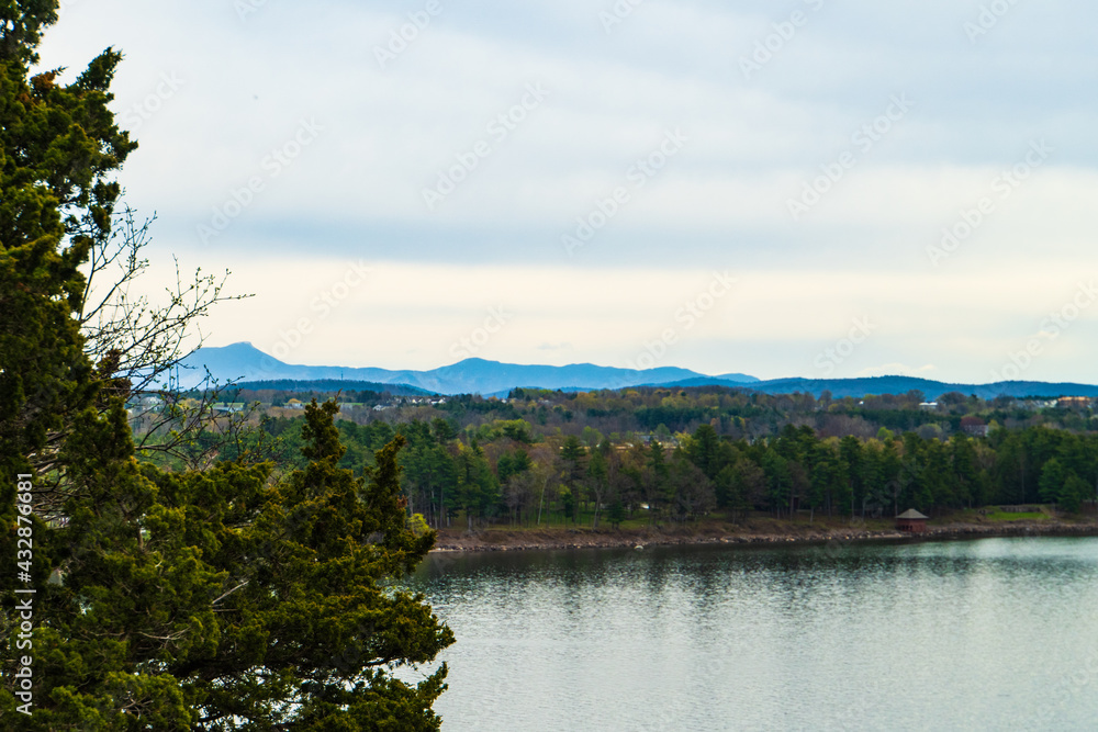 spring time view of Lake Champlain with Camels Hump Mountain off in the distance  in Vermont
