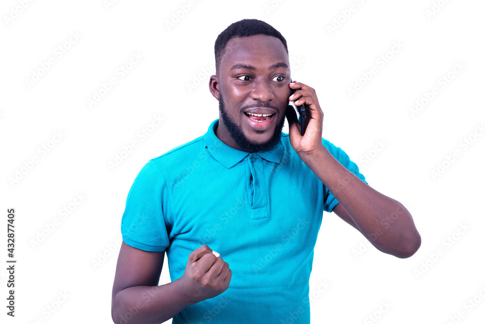 young happy man talking on cellphone. young happy man talking on cellphone.