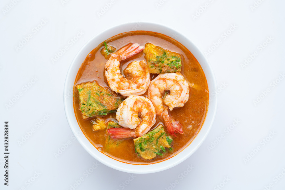 Sour soup made of Tamarind Paste with Shrimps and Vegetable Omelet - Asian food style or Thai food style isolated on white background