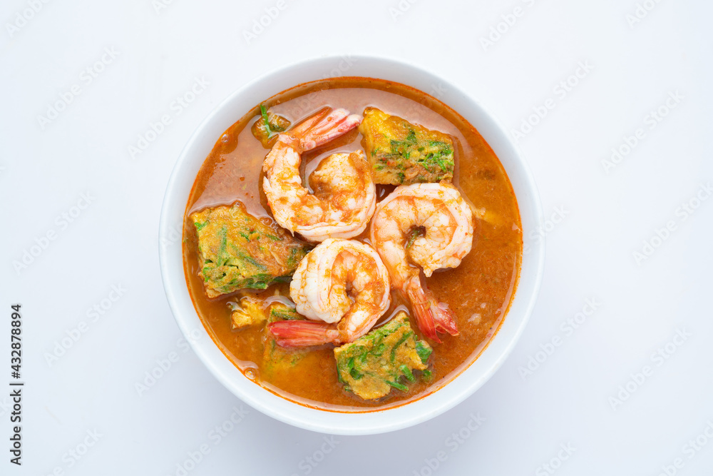 Sour soup made of Tamarind Paste with Shrimps and Vegetable Omelet - Asian food style or Thai food style isolated on white background Sour soup made of Tamarind Paste with Shrimps and Vegetable Omelet - Asian food style or Thai food style isolated on white background