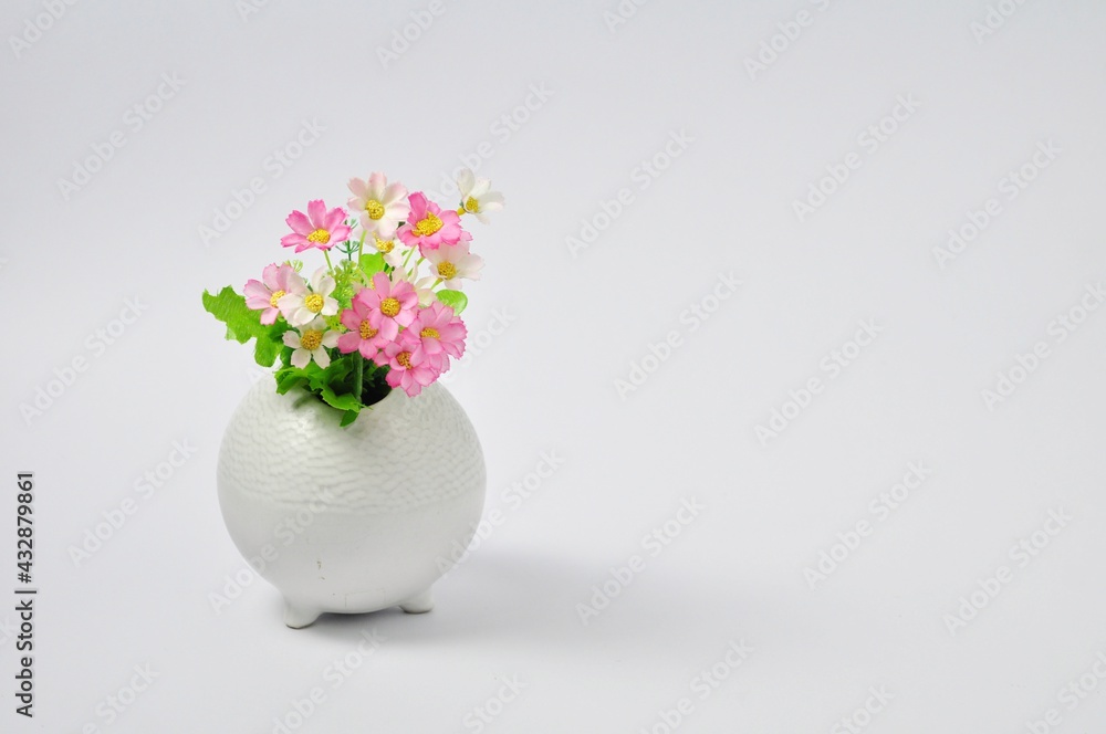 White vase on pink bouquet, separated from white background on copy space.