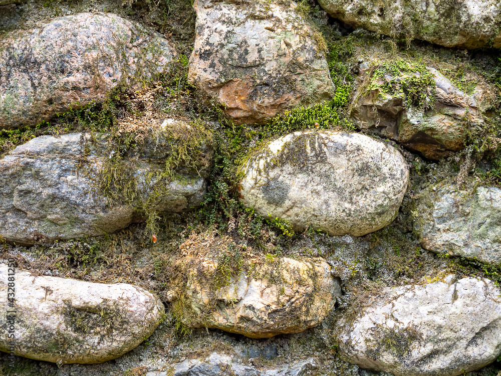 Rocks overgrown with moss. Natural background of rocks.