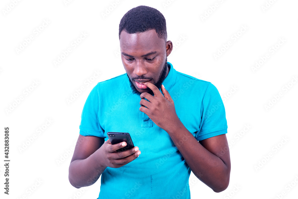 handsome young man looking at mobile phone screen. handsome young man looking at mobile phone screen.