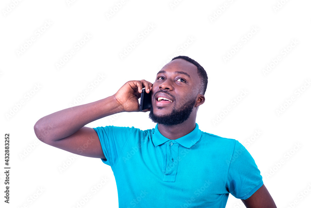 handsome young man talking on mobile phone smiling. handsome young man talking on mobile phone smiling.