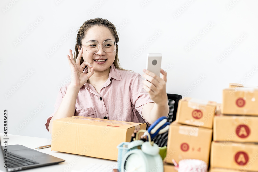 Online merchants are using a smartphone video call with store partners for a marketing planning meeting to promote the products to be sold on the website. Online sales ideas and marketing planning. Online merchants are using a smartphone video call with store partners for a marketing planning meeting to promote the products to be sold on the website. Online sales ideas and marketing planning.