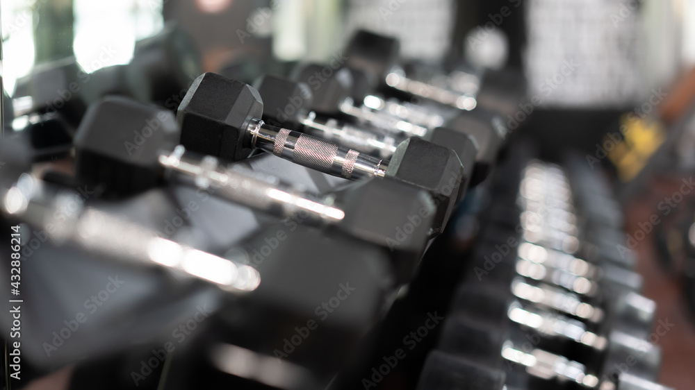 Dumbblells on a Rack in a Gym Dumbblells on a Rack in a Gym