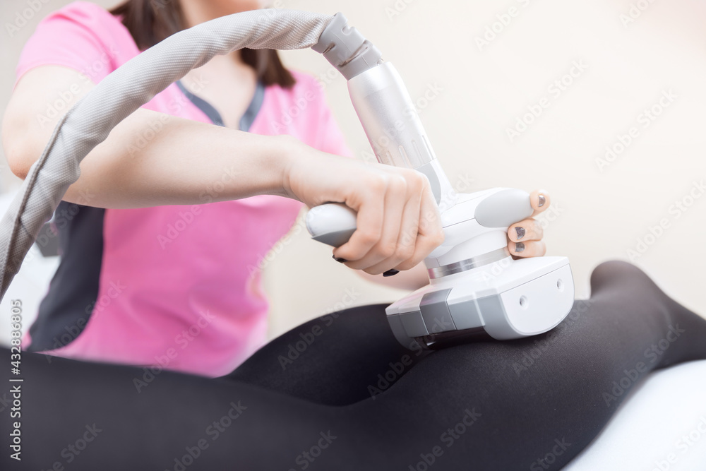 Fototapeta premium LPG machine massage procedure on legs for lifting body. Woman getting beauty therapy against cellulite in spa salon