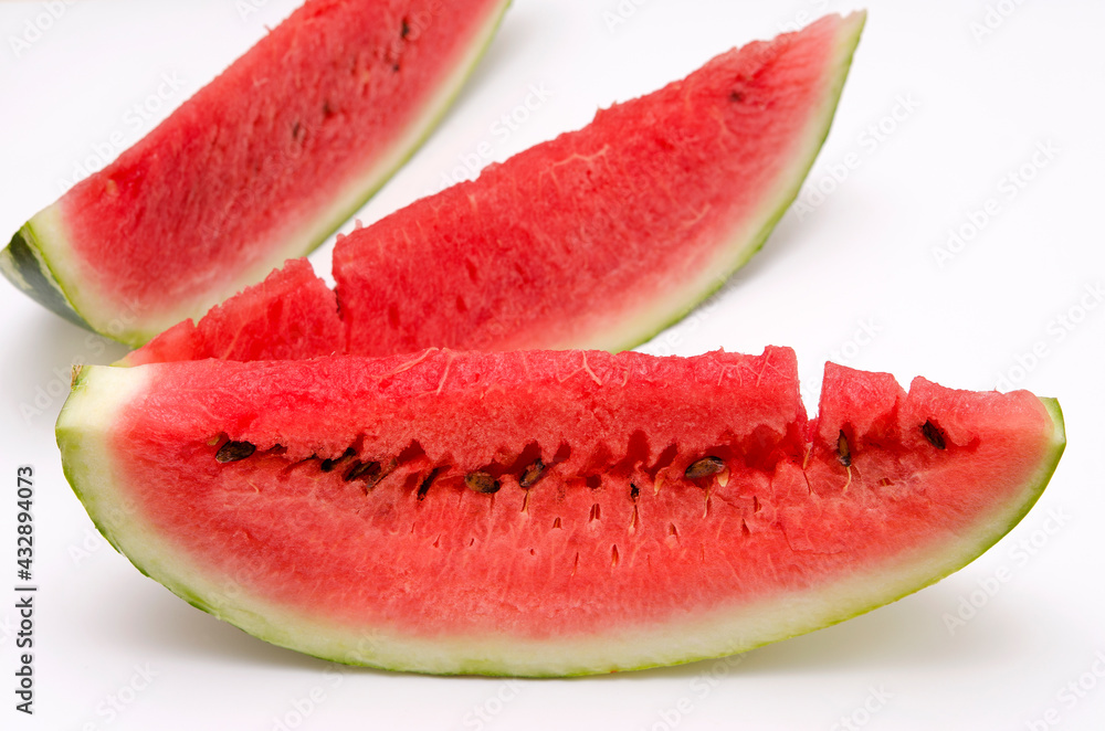 sliced pieces of watermelon close-up on a white background sliced pieces of watermelon close-up on a white background
