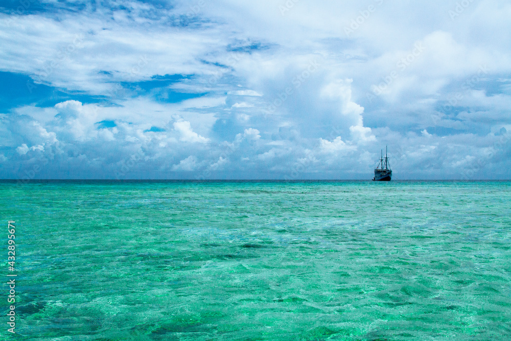 Advertising, Travel, Vacation and Holiday Concept - Beautiful pristine ocean view from a small remote island Advertising, Travel, Vacation and Holiday Concept - Beautiful pristine ocean view from a small remote island