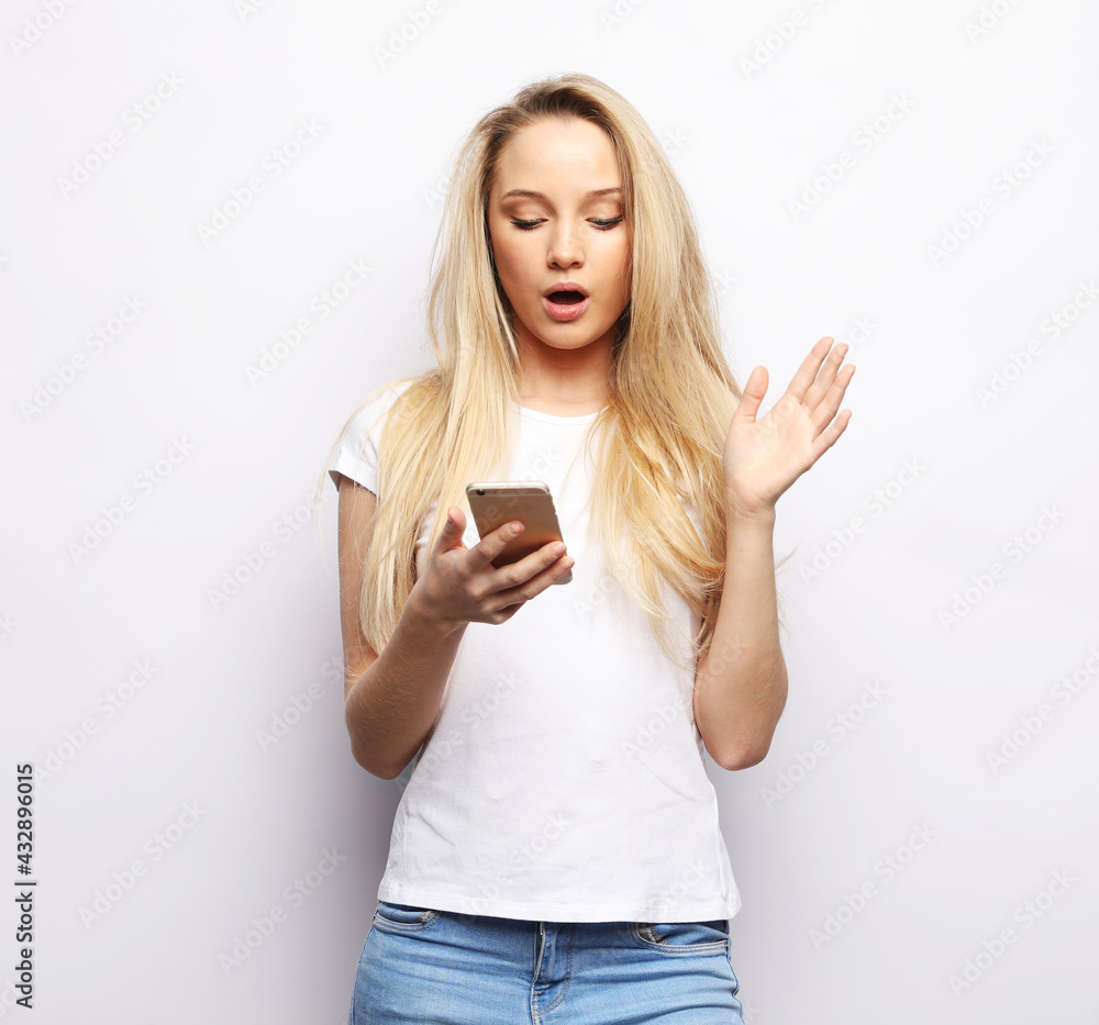 Young beautiful blond woman with smart phone Young beautiful blond woman with smart phone