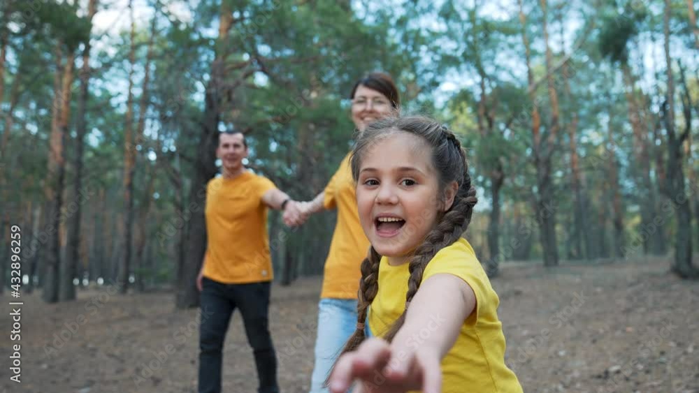 Happy family in park. Daughter and her parents are run in park. Hiking with family. Happy family have fun trip. Forest park. Daughter and her parents are running through park. Happy family in forest Happy family in park. Daughter and her parents are run in park. Hiking with family. Happy family have fun trip. Forest park. Daughter and her parents are running through park. Happy family in forest