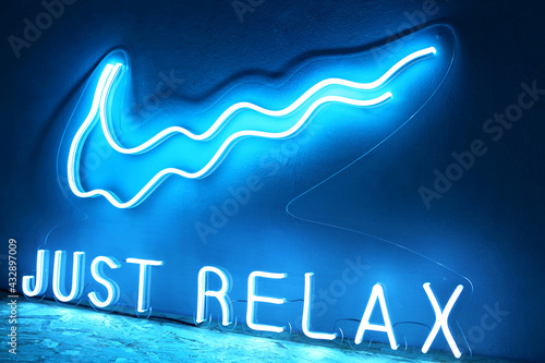 Blue neon sign just relax. Trendy style.  Neon sign. Custom neon. Home decor. photo