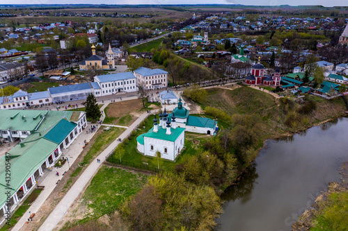 a panoramic view of the historical center of the temples and monasteries of the city of Suzdal in the rain filmed from a drone 