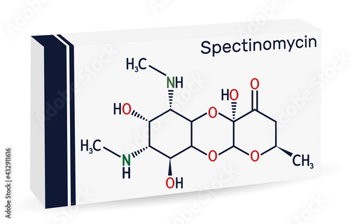 Spectinomycin molecule. It is pyranobenzodioxin , aminocyclitol aminoglycoside antibiotic. Used for the treatment of gonorrhea. Skeletal chemical formula. Paper packaging for drugs photo