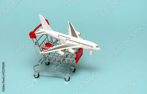 White plane on a basket. The concept of traveling and buying plane tickets.