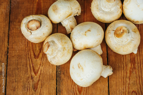 Large mushrooms. Mushrooms on a wooden background, cooking fresh mushrooms.