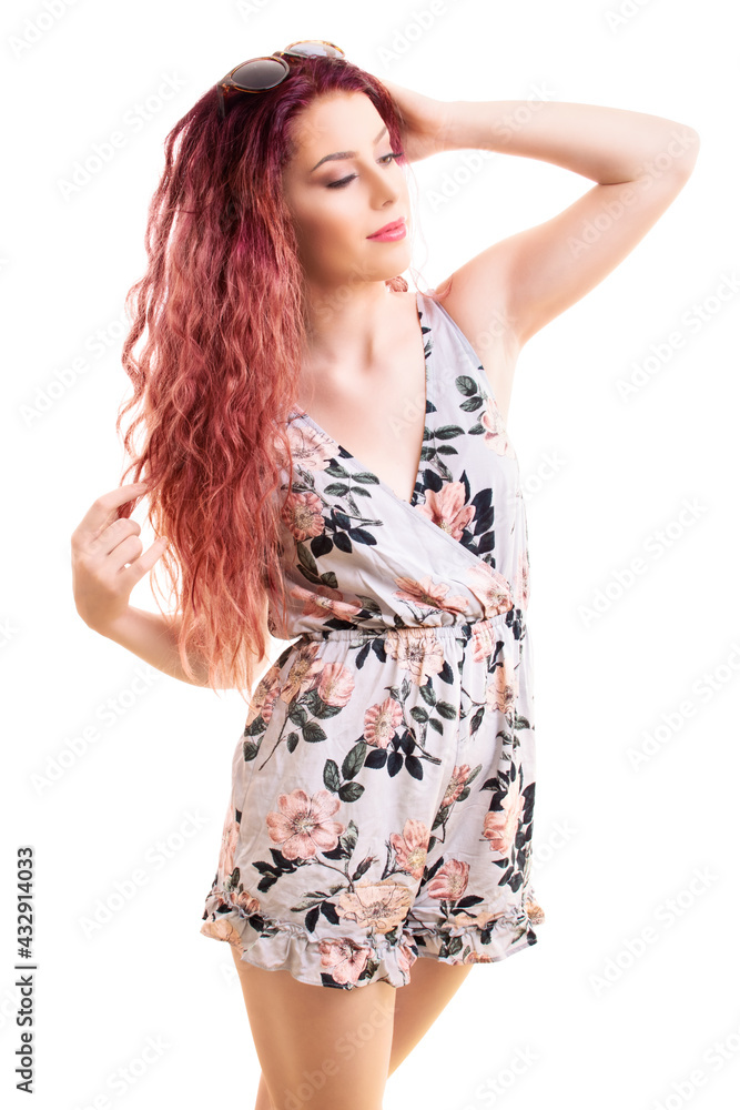 Beautiful redhead in a flowery summer outfit enjoying and posing Beautiful redhead in a flowery summer outfit enjoying and posing